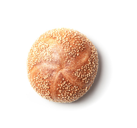 Fresh baked Kaiserbroetchen (German for emperor bread roll) with sesame seeds, isolated on white