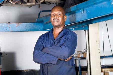 african mechanic inside garageの写真素材