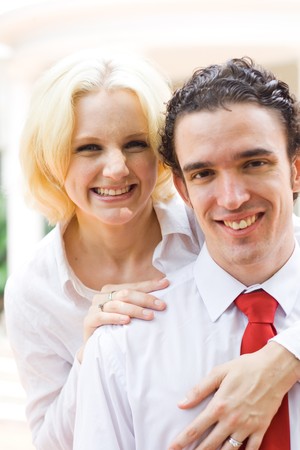 young happy couple hugging togetherの写真素材
