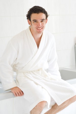 young man in bathrobe in the bathroomの写真素材