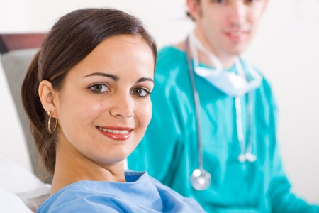 female young patient and her doctorの写真素材