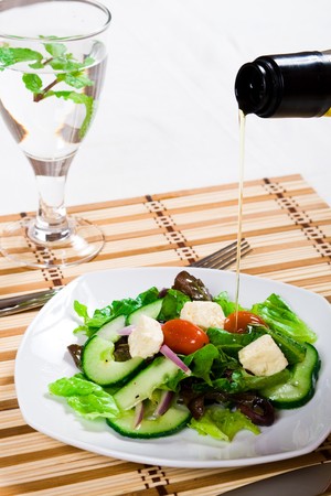 pouring salad dressingの写真素材