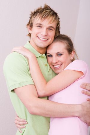 couple hugging in new homeの写真素材