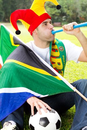 south african soccer fan blowing vuvuzelaの写真素材