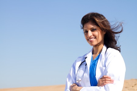 pretty arabic nurse on beachの写真素材
