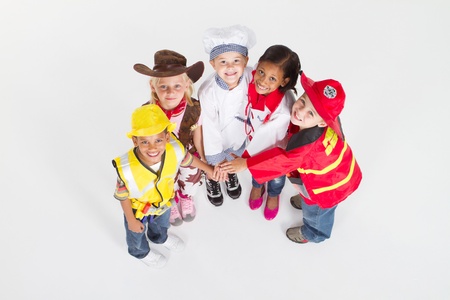 overhead view of kids in occupational uniforms teamworkの写真素材