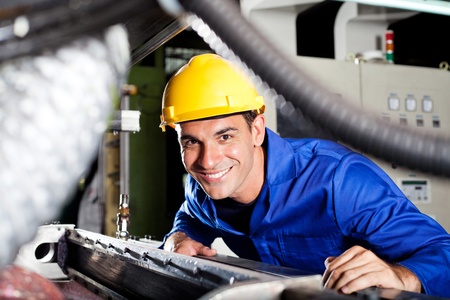 happy modern blue collar worker in factory