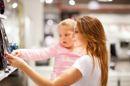 mother and daughter shopping for homewareの写真素材