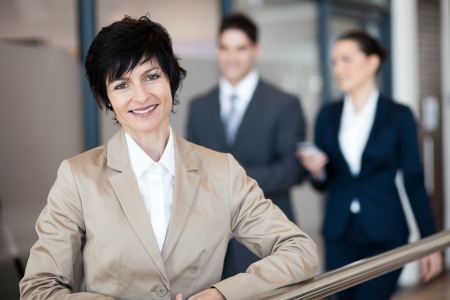middle aged businesswoman portrait outside officeの写真素材