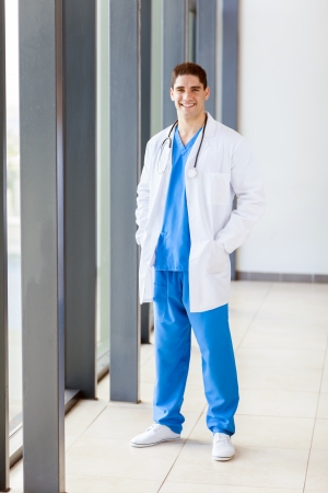 male hospital worker in scrubs full length portraitの写真素材