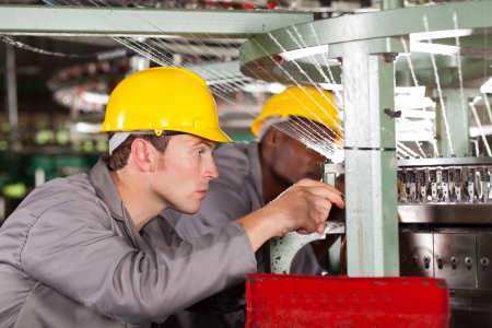 two textile weaving machine mechanics repairing loom two textile weaving machine mechanics repairing loom