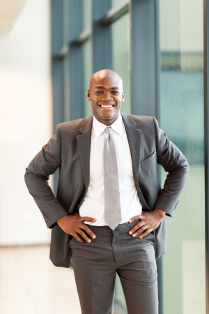 happy young african american businessman in officeの写真素材