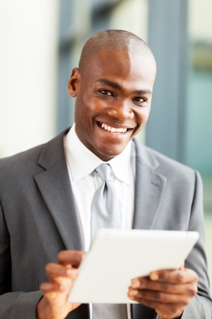 modern african businessman with tablet computer in officeの写真素材