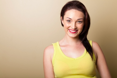 beautiful young woman studio portrait on simple backgroundの写真素材