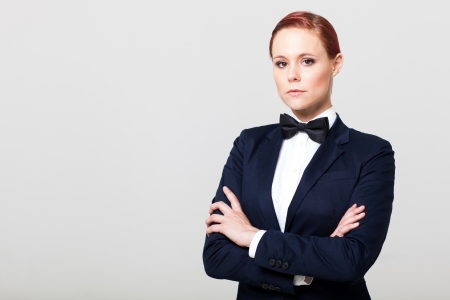 attractive fashion woman in suit with bow tieの写真素材