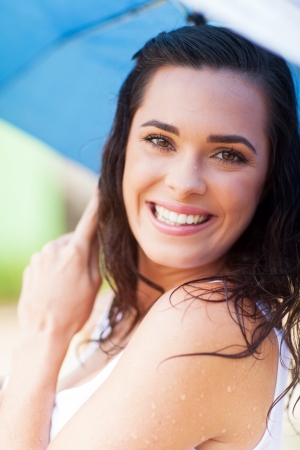 pretty woman having fun in the rainの写真素材