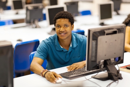 male african college student in computer room