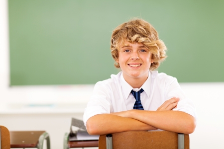 cute high school student sitting in classroomの写真素材