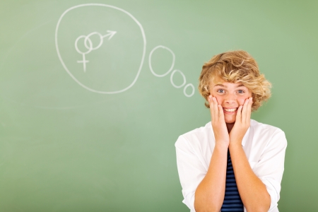funny teenage student thinking about sex in classroomの写真素材