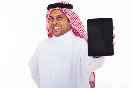 close up portrait of muslim man showing tablet computer over white backgroundの写真素材