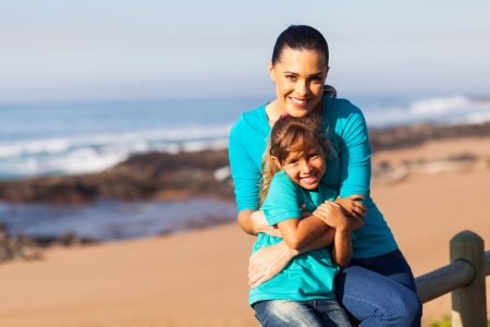 cheerful mother and daughter at the beachの写真素材