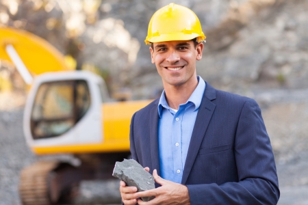 happy manager in mining site holding oreの写真素材