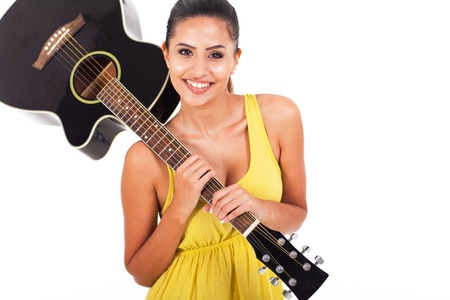portrait of beautiful woman carrying a guitar on white background