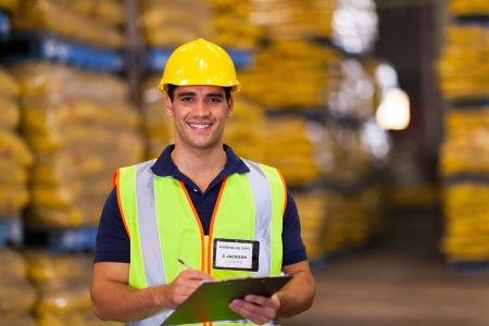 portrait of young warehouse worker indoors portrait of young warehouse worker indoors
