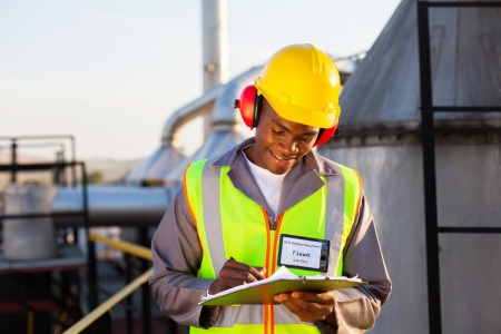 happy african american oil chemical industry worker working in plantの写真素材