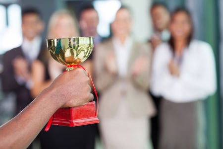 business team winning a trophyの写真素材