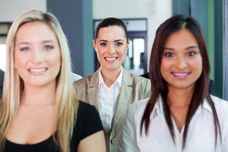 happy businesswoman among group of colleaguesの写真素材
