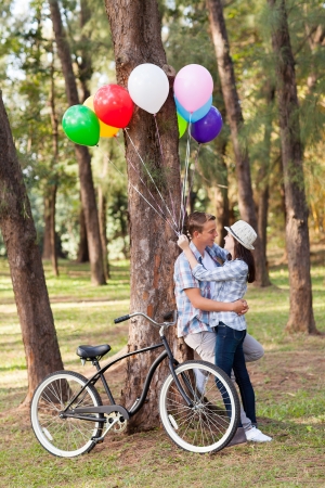 romantic young teen couple in the forestの写真素材