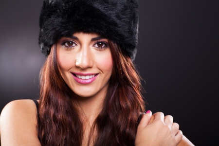 attractive young woman stduio portrait on black backgroundの写真素材