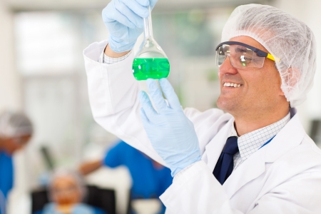 cheerful senior chemist working in labの写真素材