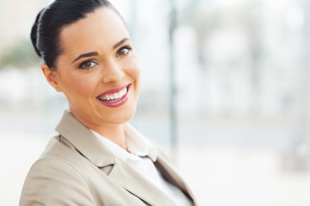 close up portrait of young business woman in modern officeの写真素材