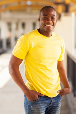 happy young african american man in shopping mallの写真素材