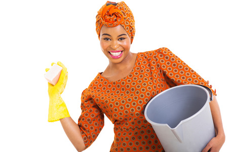 portrait of young african woman cleaning on white backgroundの写真素材