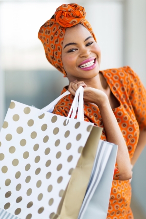 beautiful african woman shopping spree in mallの写真素材