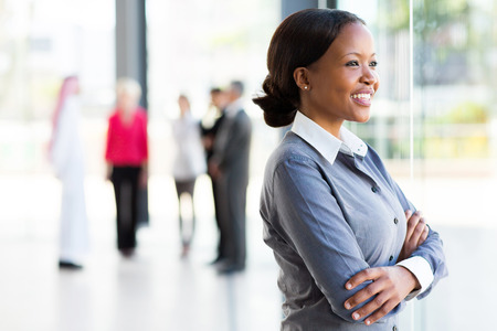 attractive black businesswoman looking outside windowの写真素材