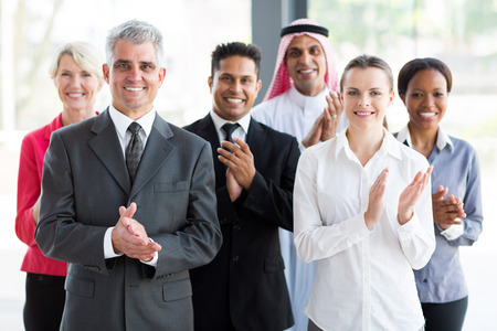 group of cheerful business people applaudingの写真素材