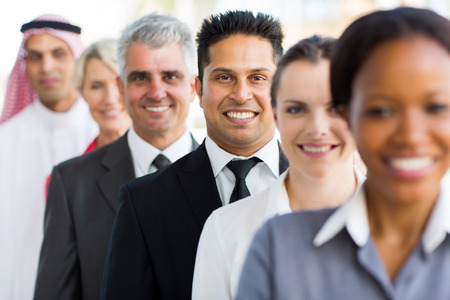 group of happy business executives standing in a rowの写真素材