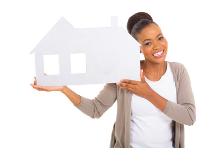 real estate agent holding paper house isolated on white backgroundの写真素材