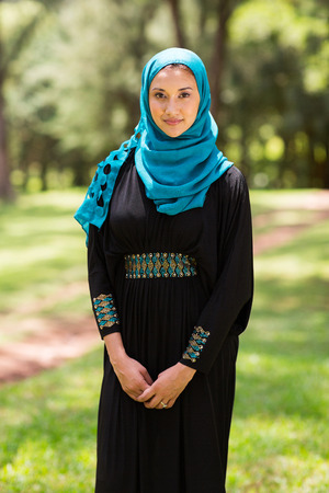pretty middle eastern woman standing outdoorsの写真素材