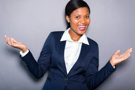 portrait of joyful african american businesswoman isolated on plain backgroundの写真素材