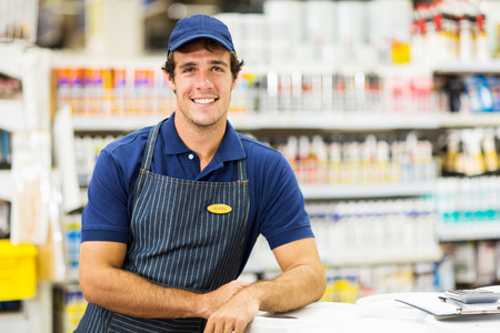 handsome hardware store worker looking at the cameraの写真素材