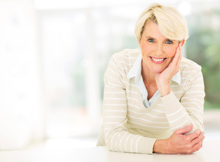smiling middle aged woman relaxing の写真素材