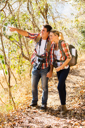 happy young couple mountain climbing togetherの写真素材