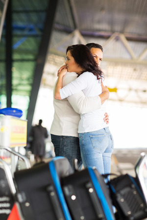 sad young couple say goodbye at airportの写真素材