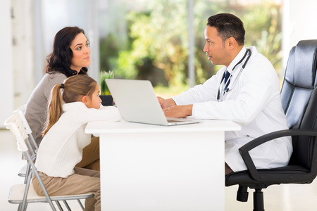 pediatric doctor talking to patient's motherの写真素材