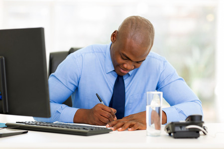 busy afro american businessman working in officeの写真素材